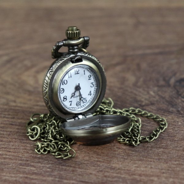 Small pocket watch with tinted glass lid